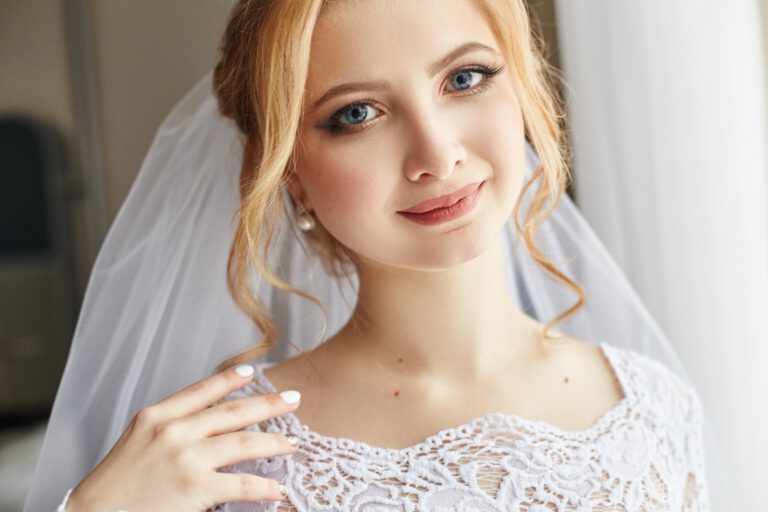 Perfect wedding day of woman bride, portrait of girl in white wedding dress in Bridal veil. Morning